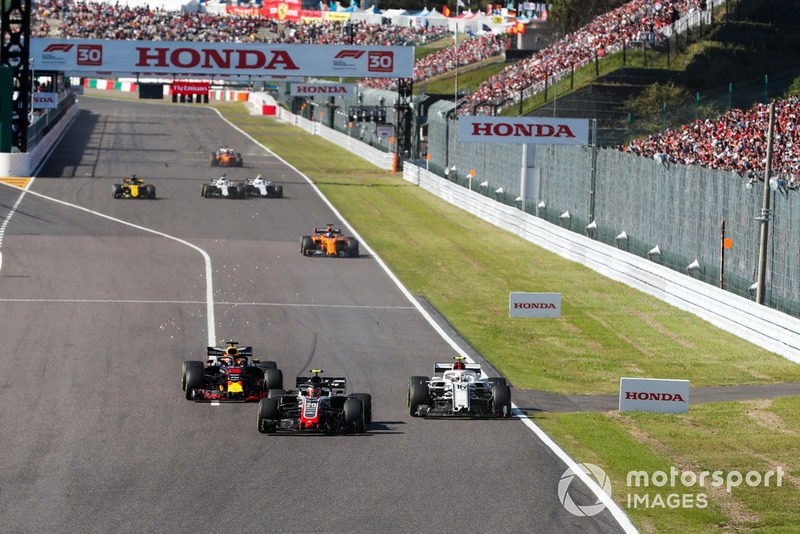 Kevin Magnussen, Haas F1 Team VF-18, battles with Charles Leclerc, Sauber C37, and Daniel Ricciardo, Red Bull Racing RB14