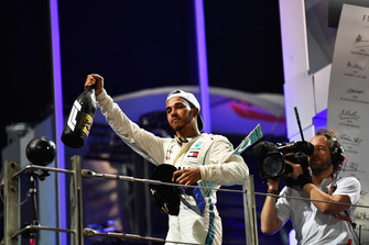 Lewis Hamilton, Mercedes AMG F1 celebrates on the podium with the trophy
