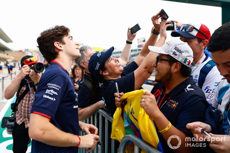 Franco Colapinto, Williams Racing, takes a selfie with a fan