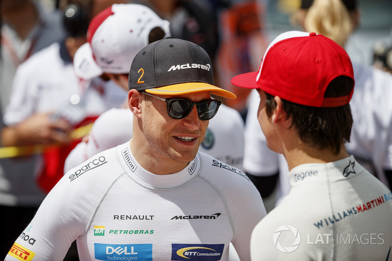Stoffel Vandoorne, McLaren, and Lance Stroll, Williams Racing, on the grid