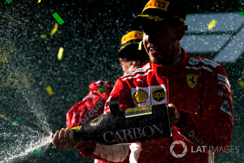 Race winner Sebastian Vettel, Ferrari celebrates with the champagne on the podium