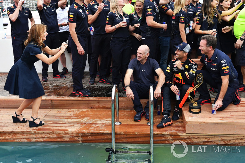 Geri Halliwell, takes a photo of Daniel Ricciardo, Red Bull Racing, Adrian Newey, Red Bull Racing at the Red Bull Racing Energy Station swimming pool