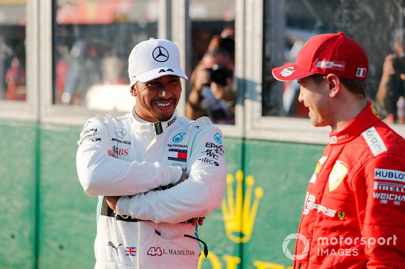 Pole Sitter Lewis Hamilton, Mercedes AMG F1 iand Sebastian Vettel, Ferrari In Parc Ferme 