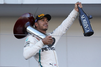 Lewis Hamilton, Mercedes AMG F1, on the podium with his trophy