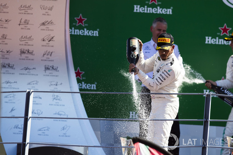 Race winner Lewis Hamilton, Mercedes AMG F1, pours Champagne from the podium