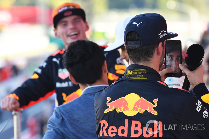 Daniel Ricciardo, Red Bull Racing celebrates with his phone on the podium