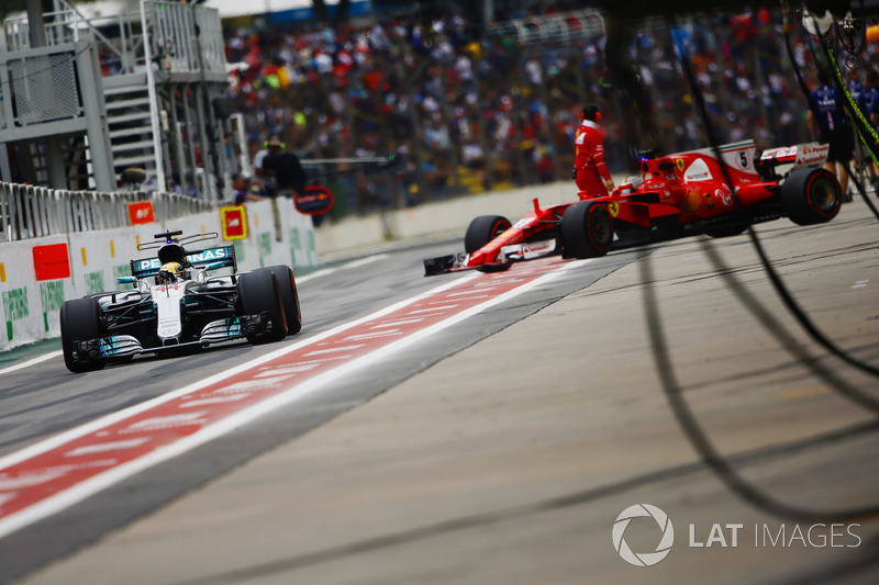 Lewis Hamilton, Mercedes AMG F1 W08, Sebastian Vettel, Ferrari SF70H, in the pit lane