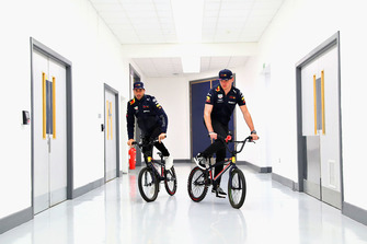 Max Verstappen, Red Bull Racing and Daniel Ricciardo, Red Bull Racing ride bikes in the factory