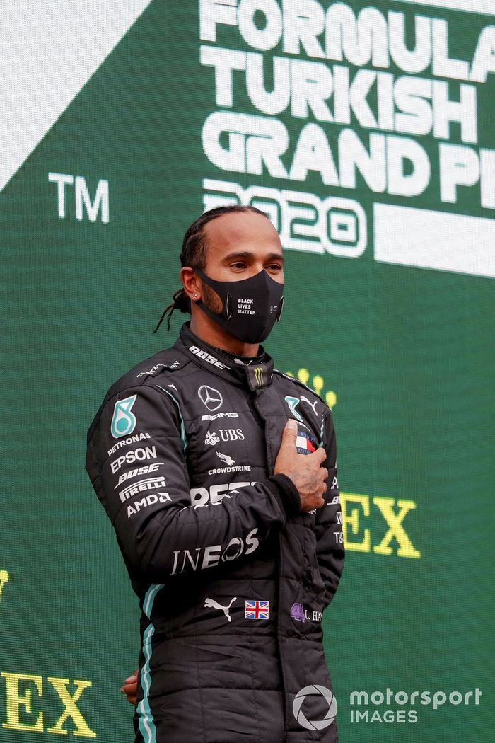 Lewis Hamilton, Mercedes-AMG F1, on the podium after winning the race, to take his 7th World Championship title