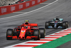 Kimi Raikkonen, Ferrari SF71H leads Lewis Hamilton, Mercedes-AMG F1 W09