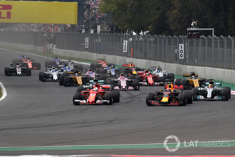 Max Verstappen, Red Bull Racing RB13 and Sebastian Vettel, Ferrari SF70H battle at the start of the 