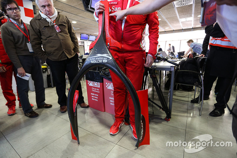 Alberto Antonini, Ferrari Press Officer discusses the Halo cockpit cover to the media