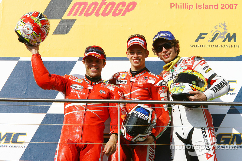 Podium: second place Loris Capirossi, Ducati; Race winner Casey Stoner; third place Valentino Rossi