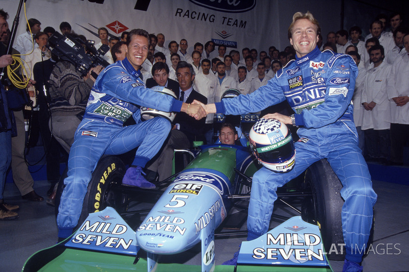 Michael Schumacher,Benetton and J.J. Lehto with Richard Grundy, Flavio Briatore, Jos Verstappen behind