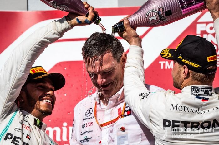 Lewis Hamilton, Mercedes AMG F1, 2nd position, and Valtteri Bottas, Mercedes AMG F1, 1st position, pour Champagne over James Allison, Technical Director, Mercedes AMG, on the podium