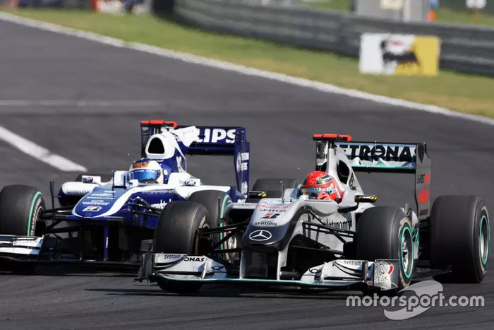 Michael Schumacher, Mercedes GP MGP W01, Rubens Barrichello, Williams FW32 
