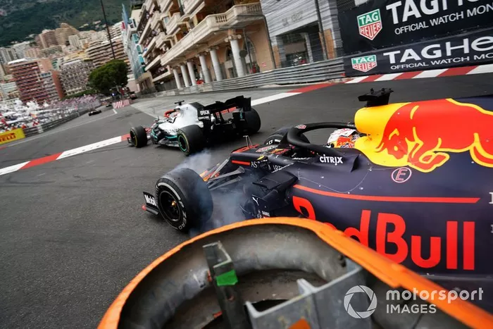 Max Verstappen, Red Bull Racing RB15, makes contact with leader Lewis Hamilton, Mercedes AMG F1 W10, in the closing stages of the race
