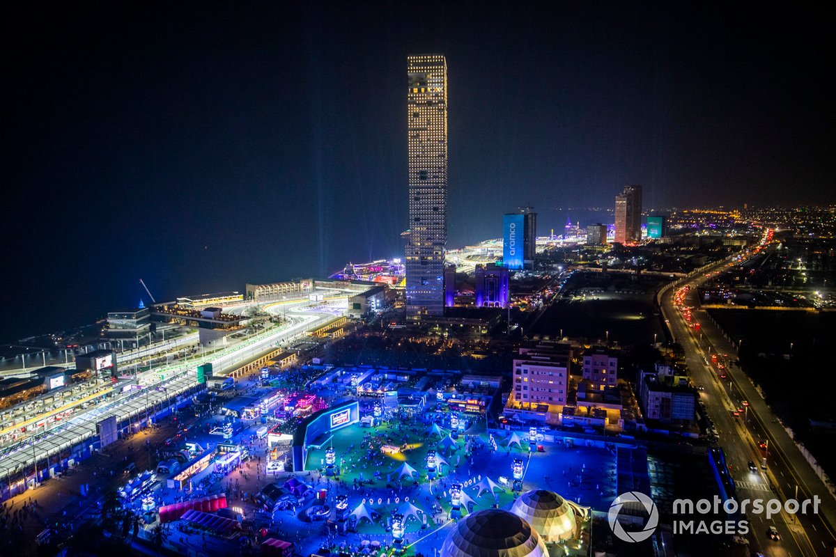 An aerial view of the circuit and city at night