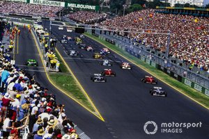 Start action, Jacques Villeneuve, Williams FW18 Renault, leads Damon Hill, Williams FW18 Renault, Eddie Irvine, Ferrari F310, and Michael Schumacher, Ferrari F310