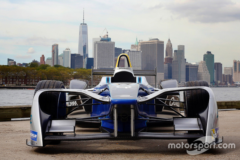 A Formula E car with the New York City skyline