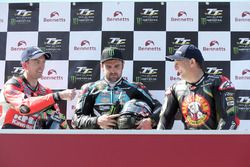 Michael Dunlop celebrates winning his third TT of the week in the Lightweight race with runner up Derek McGee and third placed Michael Rutter