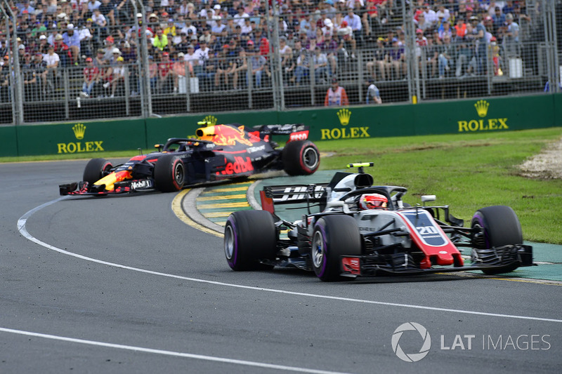 Kevin Magnussen, Haas F1 Team VF-18 as Max Verstappen, Red Bull Racing RB14 spins