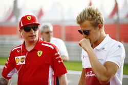 Kimi Raikkonen, Ferrari, with Marcus Ericsson, Sauber