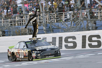 Aric Almirola, Stewart-Haas Racing, Ford Fusion Smithfield Bacon for Life, celebrates after winning in Talladega.