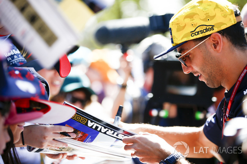 Daniel Ricciardo, Red Bull Racing, signs autographs for fans