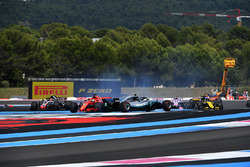 Sebastian Vettel, Ferrari SF71H hits Valtteri Bottas, Mercedes-AMG F1 W09 at the start of the race