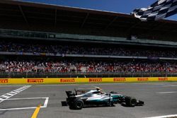 Lewis Hamilton, Mercedes AMG F1 W08, crosses the line and takes the chequered flag to win the race