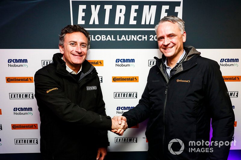 Alejandro Agag, CEO, Formula E, shakes hands with a Continental Tyres representative