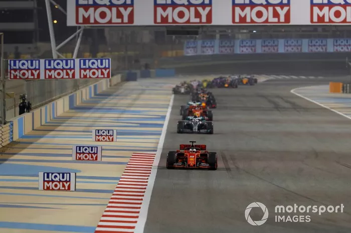 Sebastian Vettel, Ferrari SF90, leads Valtteri Bottas, Mercedes AMG W10, and Charles Leclerc, Ferrari SF90