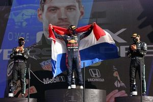 Lewis Hamilton, Mercedes, 2nd position, Max Verstappen, Red Bull Racing, 1st position, and Valtteri Bottas, Mercedes, 3rd position, celebrate on the podium