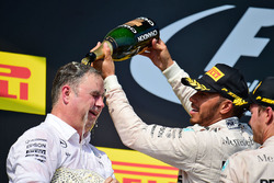 Ron Meadows, Mercedes GP Team Manager celebrates on the podium with Lewis Hamilton, Mercedes AMG F1