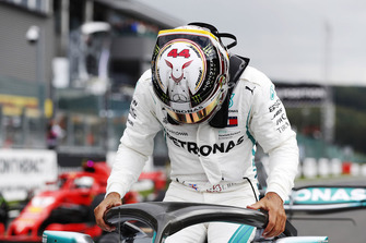 Pole winner Lewis Hamilton, Mercedes AMG F1, exits his car ahead of Sebastian Vettel, Ferrari SF71H