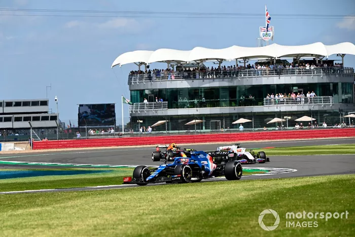 Esteban Ocon, Alpine A521, Nikita Mazepin, Haas VF-21, and Sergio Perez, Red Bull Racing RB16B