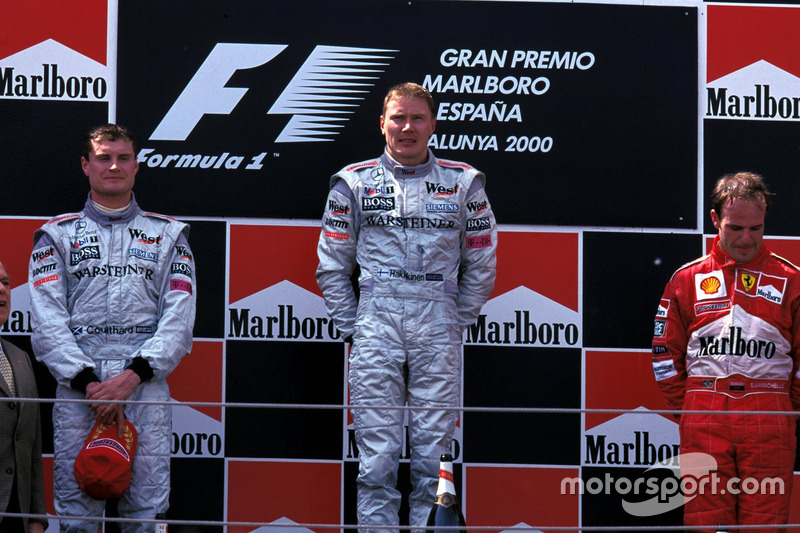 Podium: second place David Coulthard, McLaren, Race winner Mika Hakkinen, McLaren, third place Rubens Barrichello, Ferrari