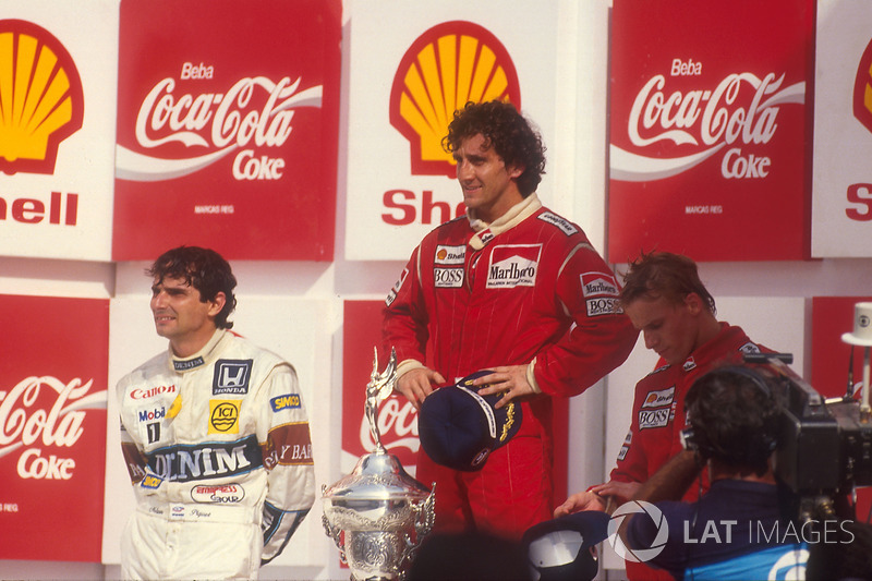 Podium: race winner Alain Prost, McLaren, second place Nelson Piquet, Williams, third place Stefan Johansson, McLaren