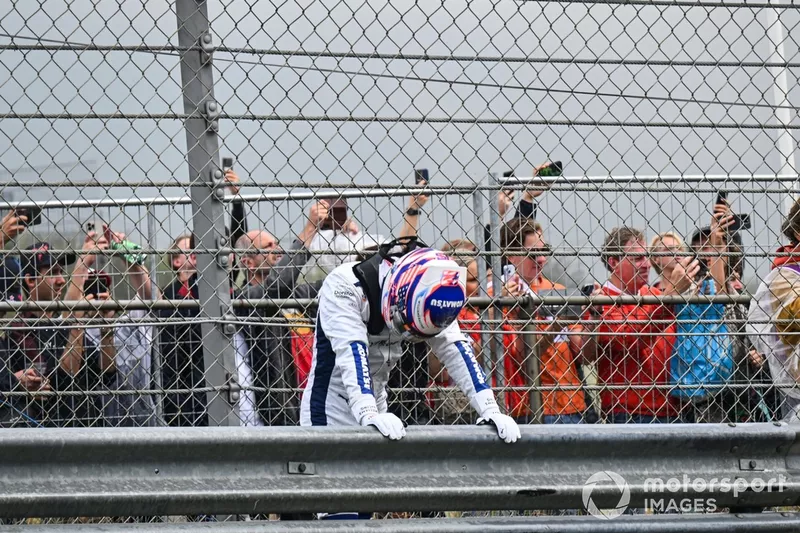 Logan Sargeant, Williams Racing, takes a breath behind the barrier after a heavy crash in FP3