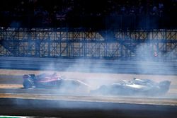 Sergio Perez, Force India VJM11, crashes into a advertising board, as Sergey Sirotkin, Williams FW41, passes by