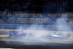 Sergio Perez, Force India VJM11, crashes into a advertising board, as Sergey Sirotkin, Williams FW41, passes by