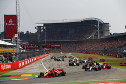 Sebastian Vettel, Ferrari SF71H, leads Valtteri Bottas, Mercedes AMG F1 W09, Kimi Raikkonen, Ferrari SF71H, Max Verstappen, Red Bull Racing RB14, Nico Hulkenberg, Renault Sport F1 Team R.S. 18, at the start of the race