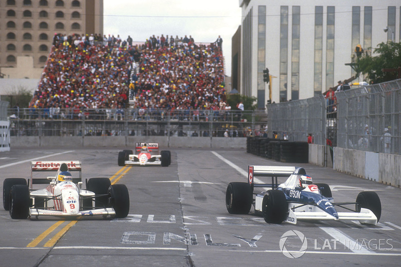 Jean Alesi Tyrrell 018 Ford laps Michele Alboreto, Arrows A11B Ford with Ayrton Senna, Mclaren MP4/5B Honda on his heels behind