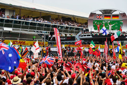 (L to R): Sebastian Vettel, Ferrari and race winner Nico Rosberg, Mercedes AMG F1 celebrate on the p