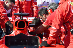 Ferrari mechanics work on the car of Sebastian Vettel, Ferrari SF70H