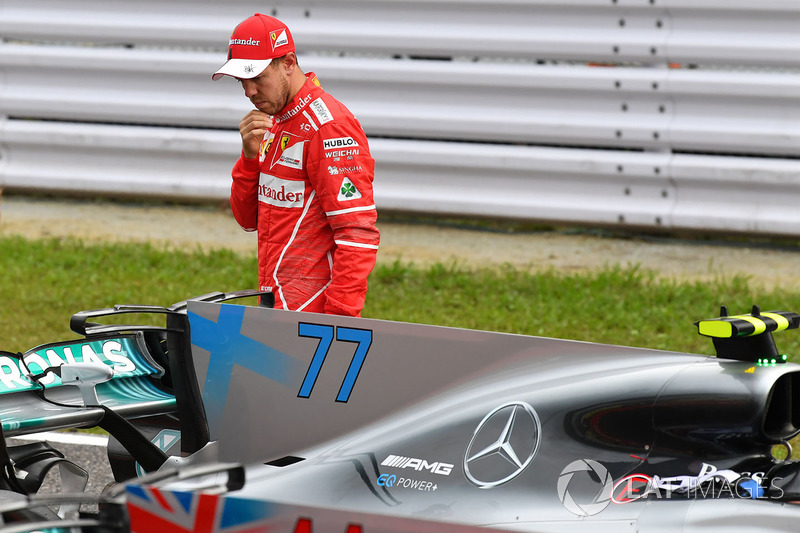 Sebastian Vettel, Ferrari looks at Mercedes-Benz F1 W08 in parc ferme