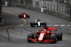 Sebastian Vettel, Ferrari SF71H, leads Lewis Hamilton, Mercedes AMG F1 W09 and Kimi Raikkonen, Ferrari SF71H