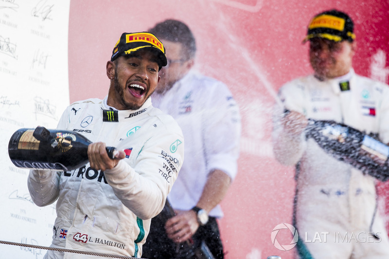Lewis Hamilton, Mercedes AMG F1, 1st position, sprays Champagne on the podium