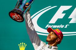 Race winner Lewis Hamilton, Mercedes AMG F1, lifts his trophy